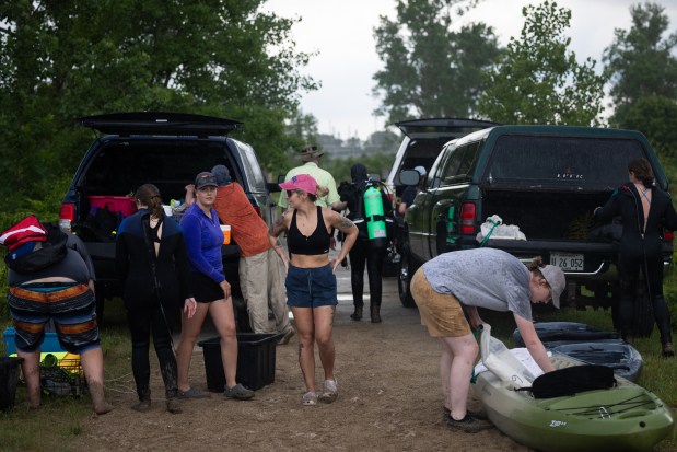 Illinois Natural History Survey's Lake Michigan biologist station team pack up from their dive after a heavy thunderstorm rolled through and cut their trip short, June 24, 2025, in Zion. (Audrey Richardson/Chicago Tribune)