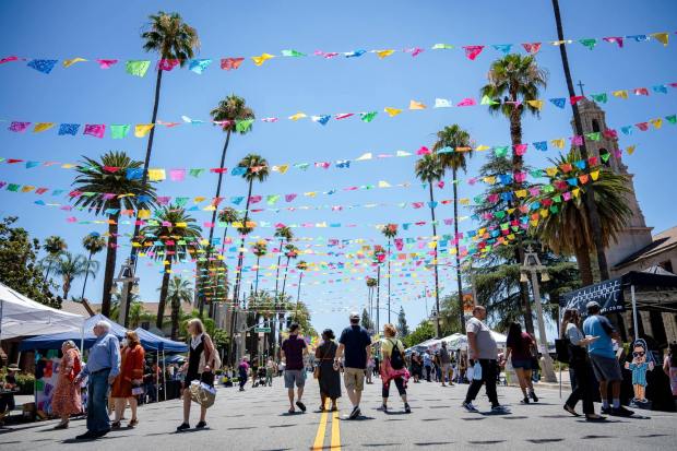 In this June 18, 2022, file photo, people walk along Mission Inn Avenue in downtown Riverside on the opening day of the Cheech Marin Center for Chicano Art & Culture. The Cheech is among the museums in Downtown Riverside and draws art fans to the Riverside Artswalk, which takes place on the first Thursday of every month. (File photo by Watchara Phomicinda, The Press-Enterprise/SCNG)