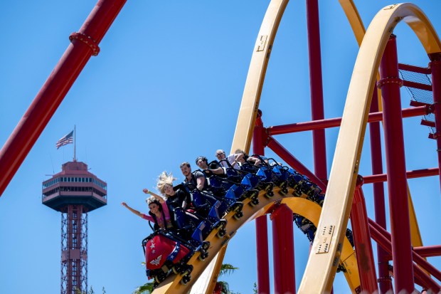 Guests ride the Wonder Woman Flight of Courage roller coaster at Six Flags Magic Mountain in Valencia. (Photo by Hans Gutknecht, Los Angeles Daily News/SCNG)