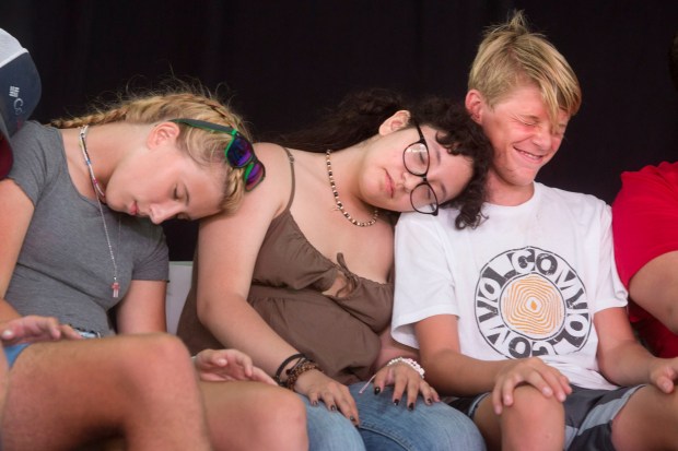 Ryan Kirrer, right, smiles during his participation in Mark Yuzuik's hypnotist show at the Orange County Fair in Costa Mesa on Thursday, August 5, 2021. (Photo by Drew A. Kelley, Contributing Photographer)