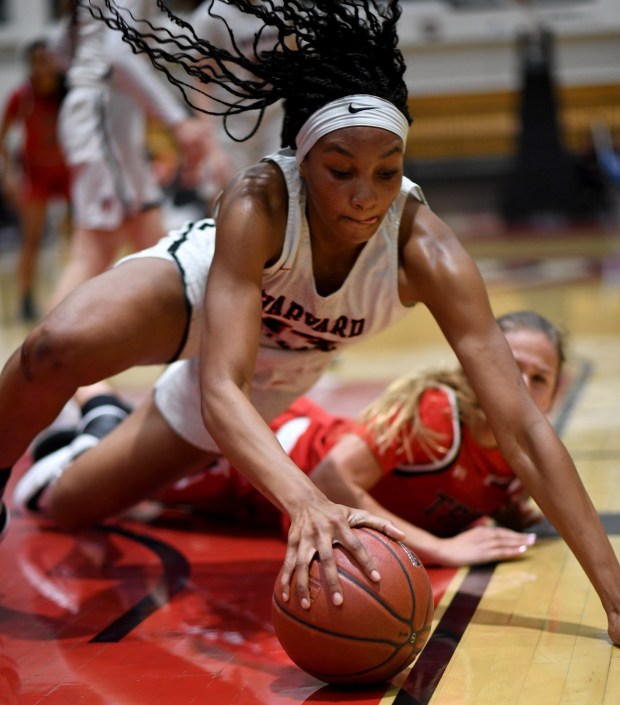 Harvard-Westlake's Kiki Iriafen dives for a loose ball against Troy in the first half of their CIF-SS Basketball Division 1 championship game Feb. 29, 2020, at Azusa Pacific. (Photo by Keith Birmingham, Pasadena Star-News/SCNG)