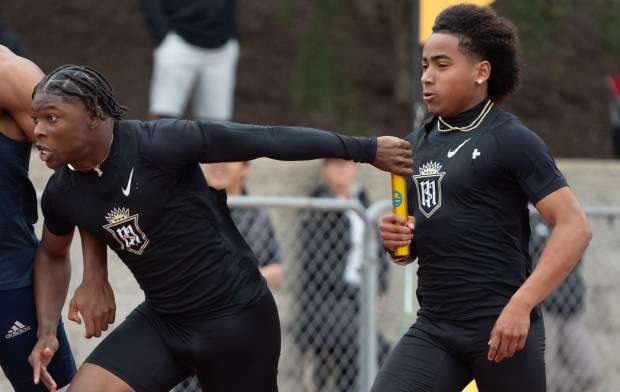 Servite's Benjamin Harris takes the baton from teammate Jorden Wells in the boys Division 3 4x100 relay during the CIF Southern Section track and field finals at Moorpark High School in Moorpark on Saturday, May 17 2025. (Photo by Miguel Vasconcellos, Contributing Photographer)