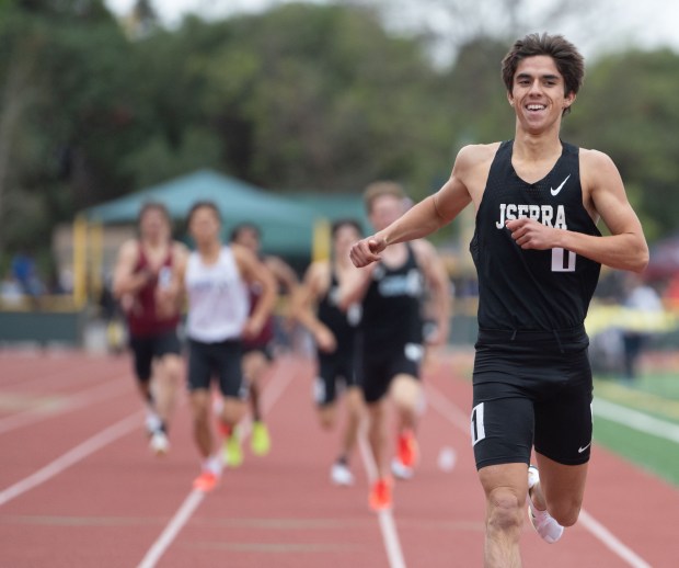 JSerra's Alden Morales smiles as he crosses the finish line during the Division 3 boys 800m race during the CIF Southern Section track and field finals at Moorpark High School in Moorpark on Saturday, May 17 2025. (Photo by Miguel Vasconcellos, Contributing Photographer)