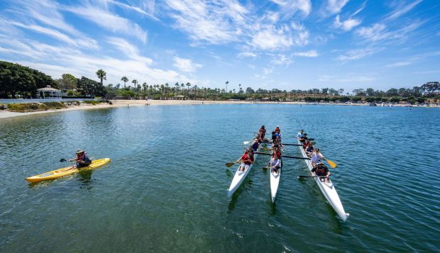 In this July 20, 2023, file photo, campers paddle their outrigger canoes from the Newport Dunes Waterfront Resort to the Newport Aquatic Center during their Surf and Paddle Camp. The Newport Dunes Waterfront Resort & Marina will host a series of live music performances, food trucks and beach activities for Memorial Day weekend from Friday, May 23, through Sunday, May 25. (Photo by Mark Rightmire, Orange County Register/SCNG)