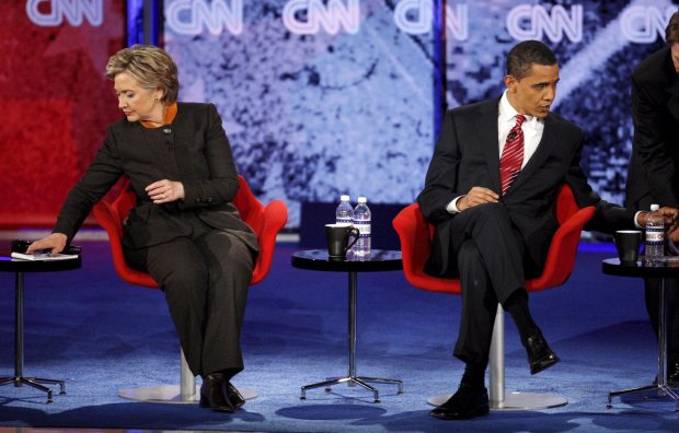 A file picture dated Jan. 21, 2008, shows New York Senator Hillary Clinton (L) and Illinois Senator Barack Obama (R) checking notes during a break in the CNN/Congressional Black Caucus democratic party presidential debate at the Palace Theatre in Myrtle Beach, South Carolina. (EPA/MATT CAMPBELL)