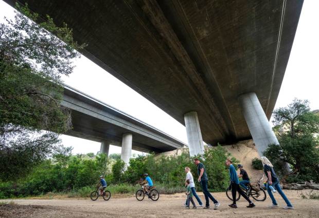 Cyclists and hikers make their way beneath the 241 tollroad along Arroyo Trabuco Trail in O'Neill Regional Park in Trabuco Canyon in early June 2025. The park encompasses 4,500 acres in Trabuco and Live Oak Canyons and includes 23 miles of trails and a campground. (Photo by Mark Rightmire, Orange County Register/SCNG)
