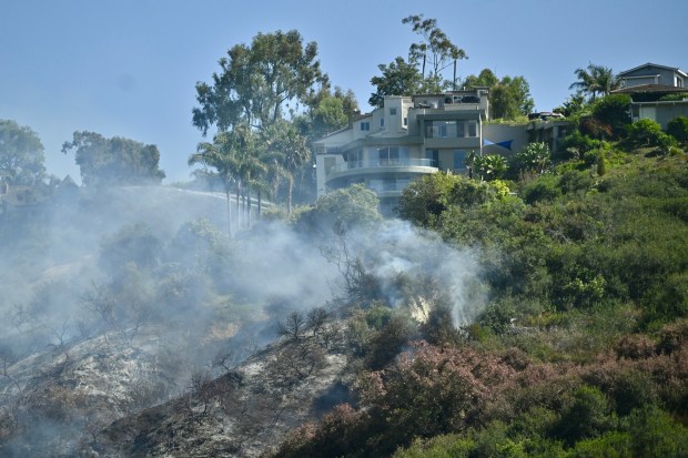 Firefighters battle the Rancho Fire in Laguna Beach, CA on July 7, 2025. ￼ (Photo by Jeff Gritchen, Orange County Register/SCNG)