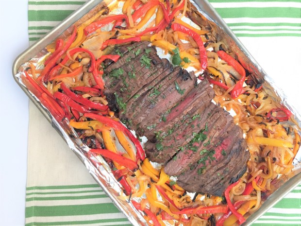 Sheet Pan Fajita Flank Steak with Peppers and Onions is made with meat that has been marinated for several hours in a garlicy, lime-scented mixture. (Photo by Cathy Thomas)