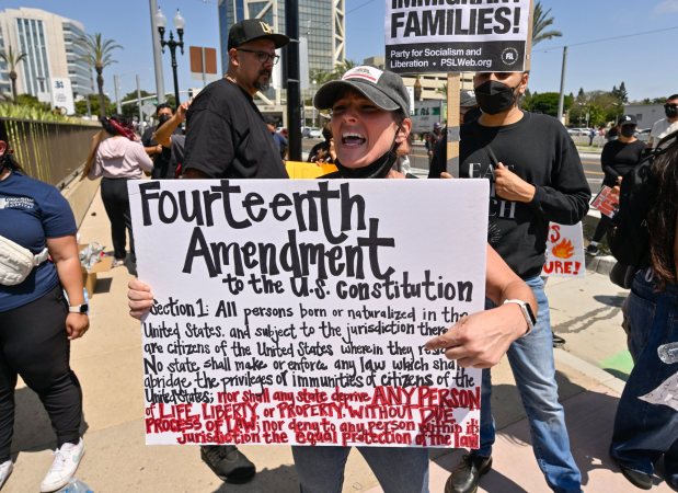 Protesters yell at police at the driveway to the Federal Building while police stand guard in Santa Ana, CA, on Monday, June 9, 2025. About 200 anti-ICE protesters spent the afternoon carrying signs as they chanted and yelled at police. (Photo by Jeff Gritchen, Orange County Register/SCNG)