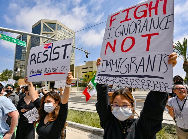 Protesters rally at the Federal Building while police stand guard in Santa Ana, CA, on Monday, June 9, 2025. About 200 anti-ICE protesters spent the afternoon carrying signs as they chanted and yelled at police. (Photo by Jeff Gritchen, Orange County Register/SCNG)