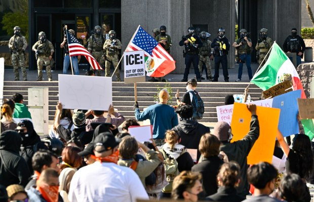 Protesters stand off against police at the Federal Building in Santa Ana, CA, on Monday, June 9, 2025. About 400 anti-ICE protesters spent the afternoon carrying signs as they chanted and yelled at police. (Photo by Jeff Gritchen, Orange County Register/SCNG)