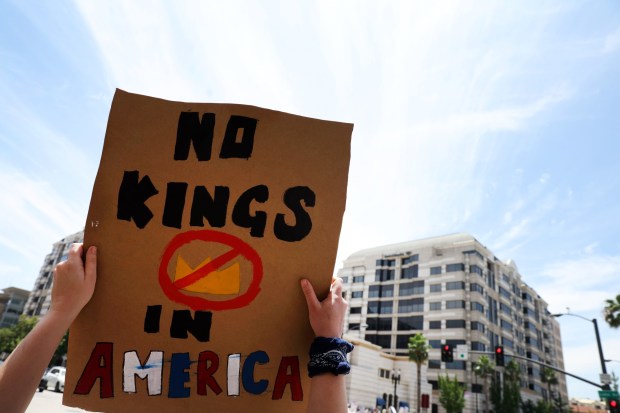 People gather in Pasadena along Colorado Boulevard for the "No Kings Day" protest against President Trump and his policies, on Saturday, June 14, 2025. More than 1,500 similar demonstrations were held nationwide. (Photo by Trevor Stamp, Contributing Photographer)
