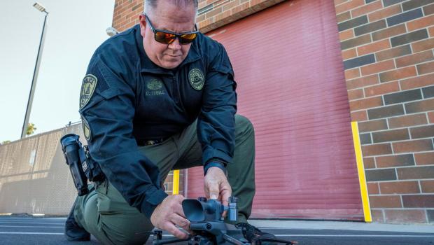 Riverside Police Department Detective Cole Tuggle attaches spotlights and a loudspeaker to a drone on Wednesday, June 18, 2025. Police will use drones this July 4 to catch people using illegal fireworks in Riverside. (Photo by Terry Pierson, The Press-Enterprise/SCNG)