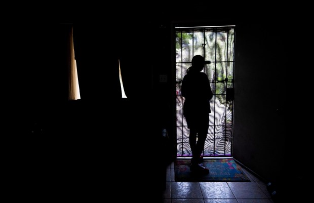 Maria Murillo, wife of ICE detainee Jose Luis Zavala stands in her front door way wondering when and if her husband will be released to come home on bond to Pomona on Thursday, July 17, 2025. (Photo by Terry Pierson, The Press-Enterprise/SCNG)
