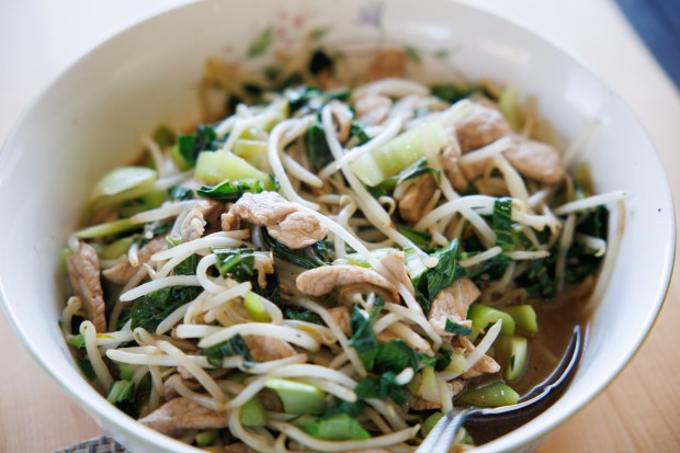 Pictured is a bowl of stir-fried pork, bok choy, and bean sprouts Randy Tom made for lunch at his Redwood City home on June 27, 2025. (Dai Sugano/Bay Area News Group)