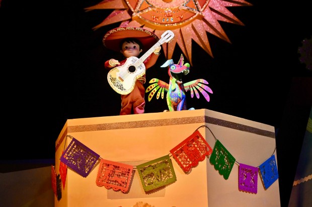 Miguel, from Pixar's Coco, with his spirit animal Dante, in It's a Small World inside Disneyland￼ ￼in Anaheim, CA, on Tuesday, May 13, 2025￼. Disneyland is celebrating its 70th anniversary from May 16, 2025 through summer 2026... (Photo by Jeff Gritchen/MediaNews Group/Orange County Register via Getty Images)
