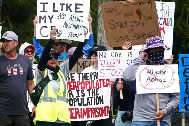 Protesters converge outside the Dade-Collier Training and Transition Airport on Tamiami Trail E, Ochopee, on July 1, 2025, site of the new immigration detention center, Alligator Alcatraz. (Joe Cavaretta/South Florida Sun Sentinel)