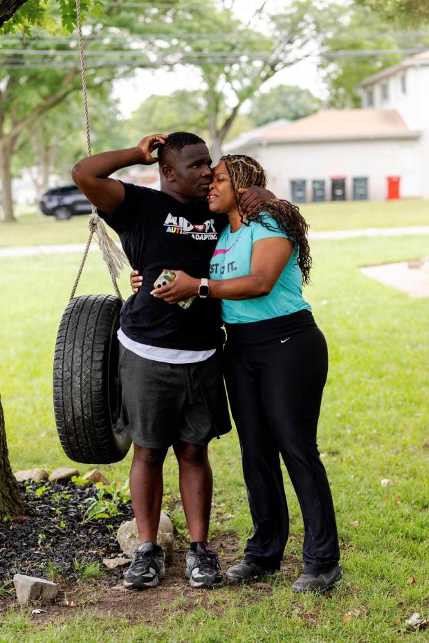 Adrienne Hazel, right, hugs her son Ricky